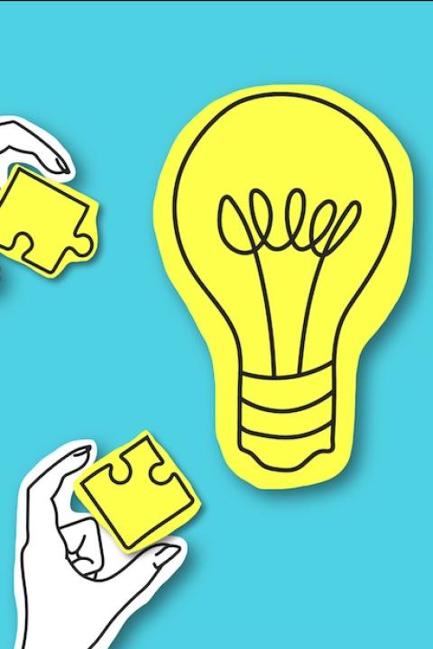 hands reaching toward a light bulb — people coming together to create ideas — employee collaboration — employees